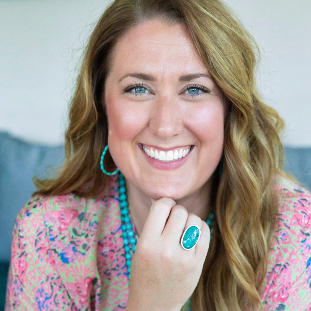 A woman with stunning eyes leans into the photo