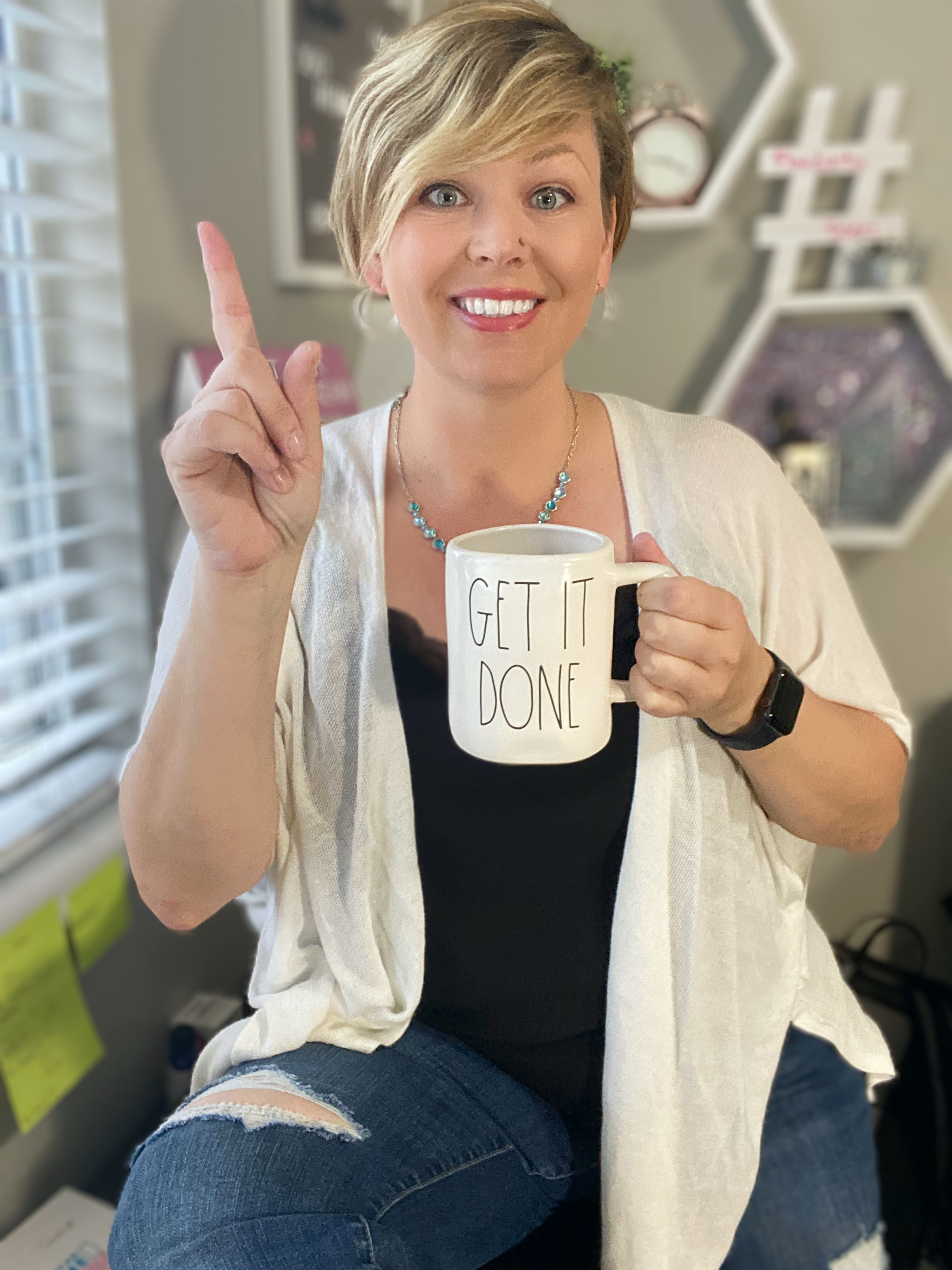 Samantha smiles with her "get it done' mug